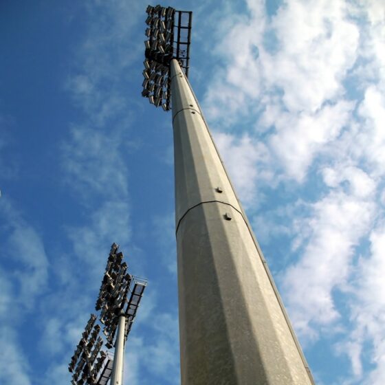 60 Foot Stadium Light Pole: installation view with cross arms in a stadium setting